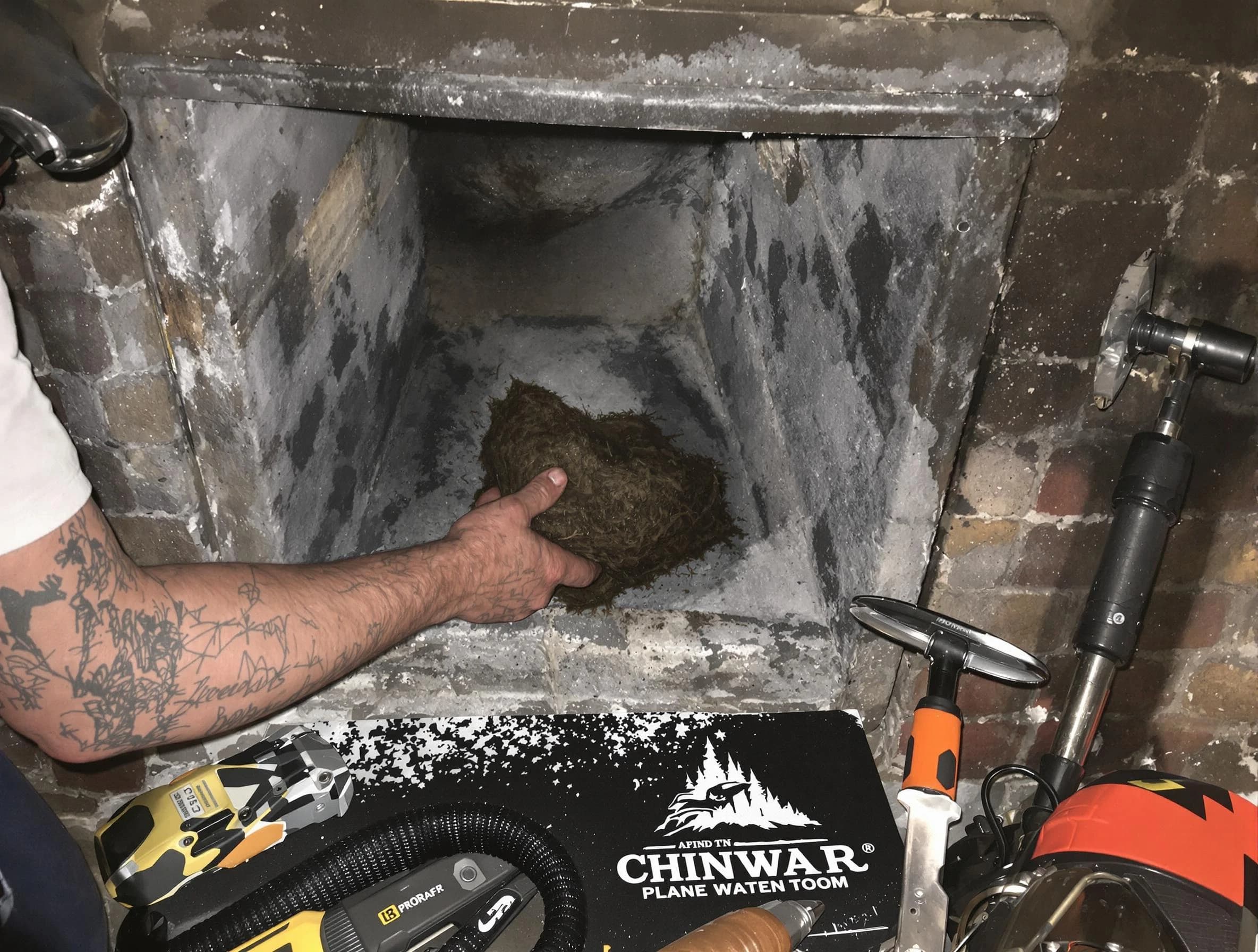 Tarrant Chimney Sweep safely removing debris and screening chimney in Tarrant, AL